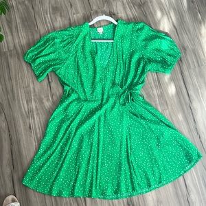 A New Day green dot faux wrap dress. It has pockets.